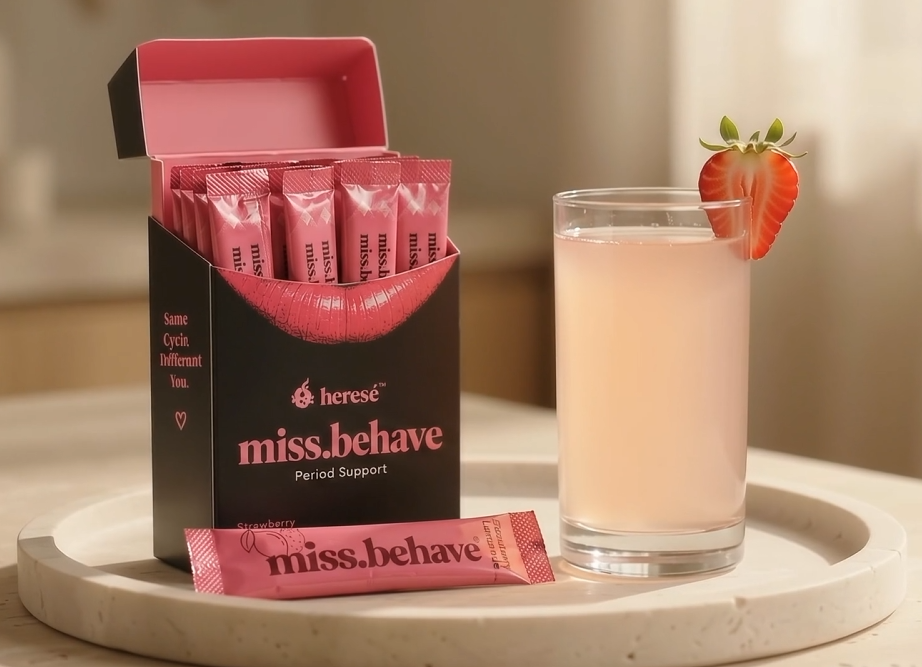 Supplied miss.behave photograph showing an open seven-sachet box, a pink powder sachet and a glass of Strawberry Lemonade drink